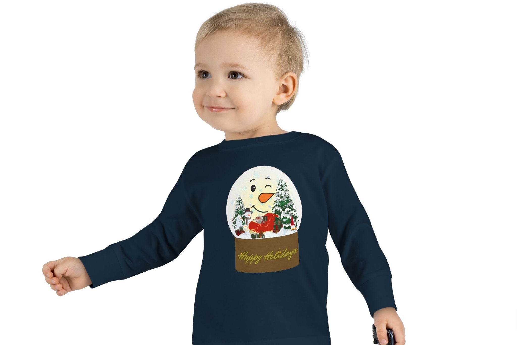 Child wearing a navy blue long-sleeve shirt with a snowman design on a white background
